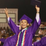 High School is over for this grad as he celebrates in Tiger Stadium.